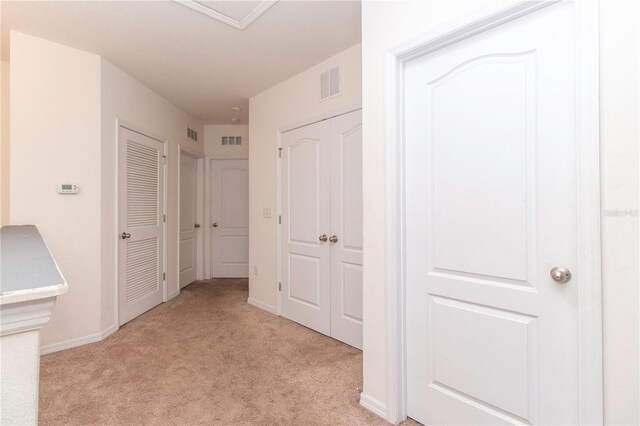 12827 Buffalo Run Dr, Gibsonton, FL 33534 - corridor with light carpet and baseboards