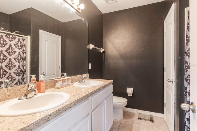 12827 Buffalo Run Dr, Gibsonton, FL 33534 - bathroom with double vanity, tile patterned floors, toilet, baseboards, and curtained shower