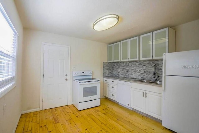 kitchen with sink, light hardwood / wood-style floors, white appliances, decorative backsplash, and white cabinets