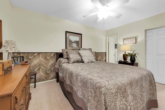 bedroom featuring light carpet and ceiling fan