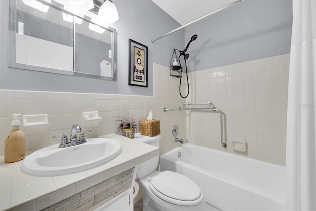 full bathroom with toilet, vanity, shower / tub combo with curtain, and tile walls