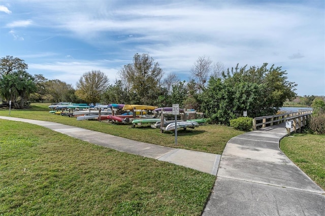 view of property's community featuring a lawn