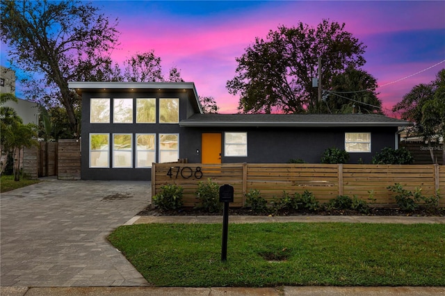 contemporary house featuring a yard