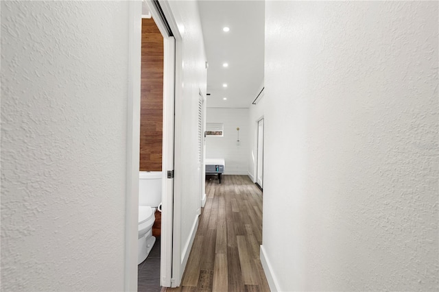 corridor featuring wood-type flooring