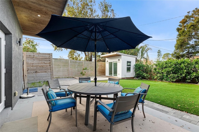 view of patio with an outdoor structure