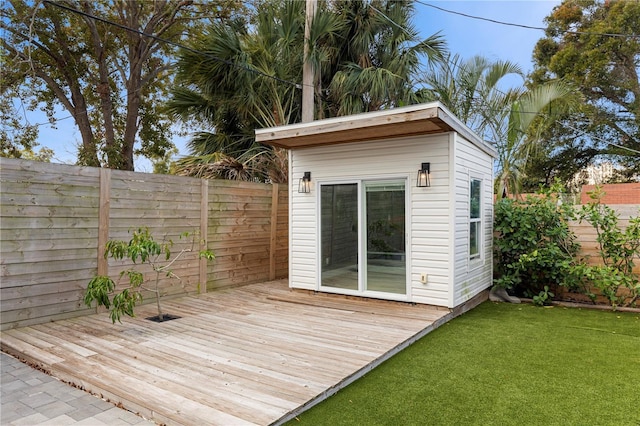 view of outbuilding with a yard