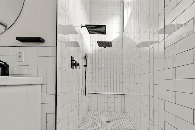 bathroom featuring tiled shower and tile walls