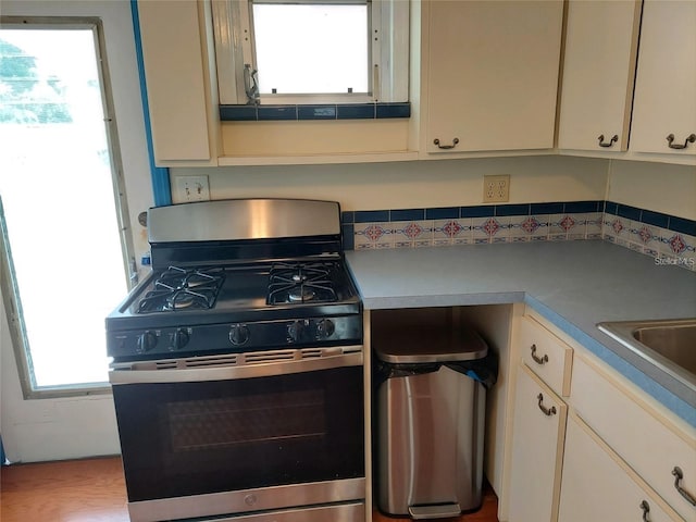 kitchen with stainless steel gas range oven