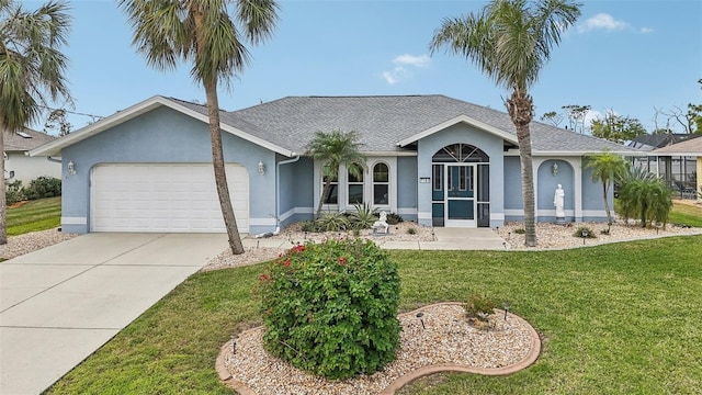 single story home with a garage and a front lawn