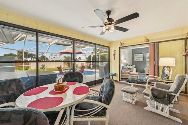 sunroom / solarium with ceiling fan