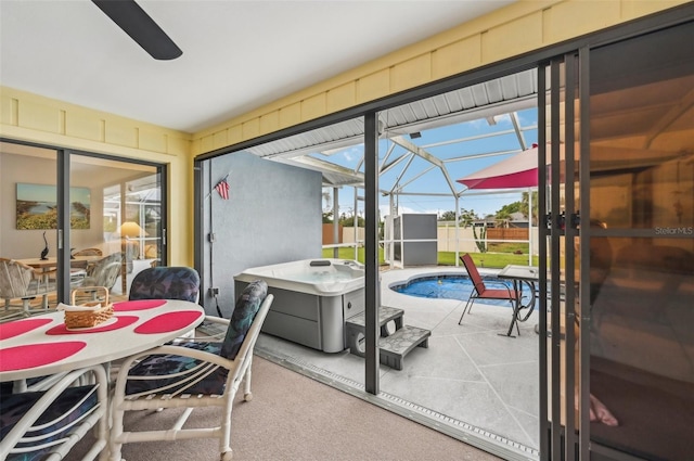 doorway featuring ceiling fan