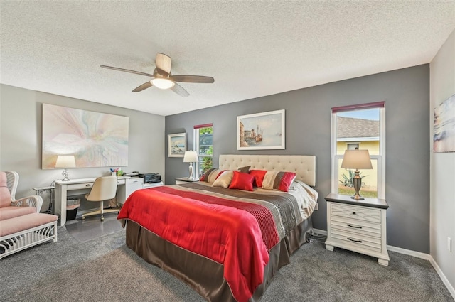 carpeted bedroom featuring a textured ceiling and ceiling fan