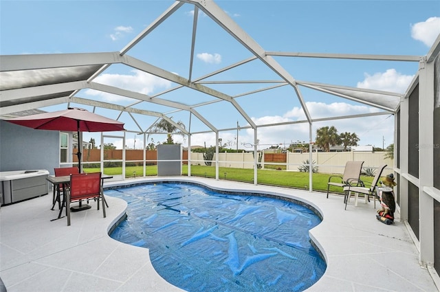 view of pool with a lanai, a lawn, and a patio area