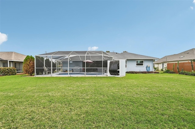 rear view of property with a lawn