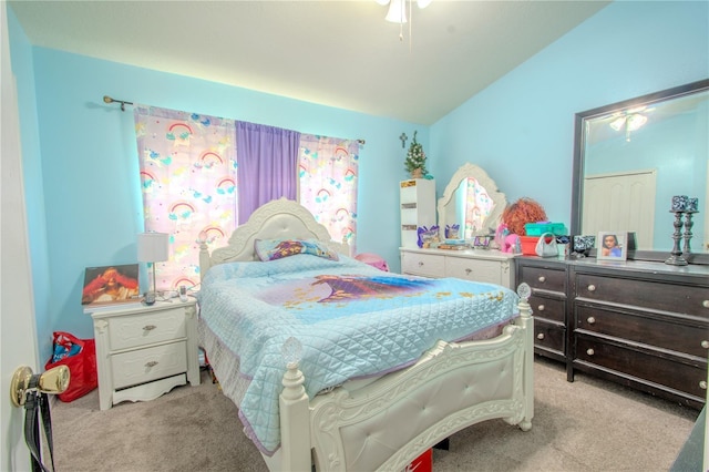 bedroom with light colored carpet and vaulted ceiling