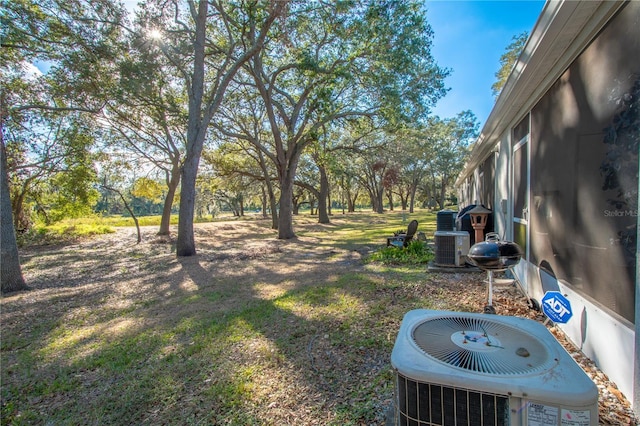 view of yard with central AC unit