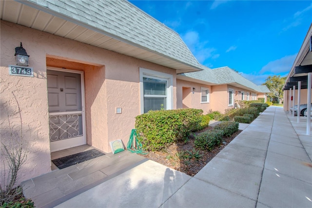 property entrance with a patio