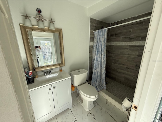 bathroom featuring a shower with curtain, vanity, and toilet