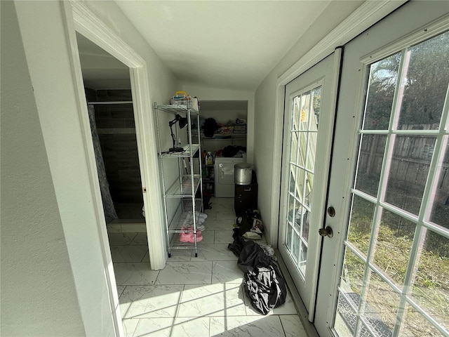 interior space featuring french doors and washing machine and clothes dryer