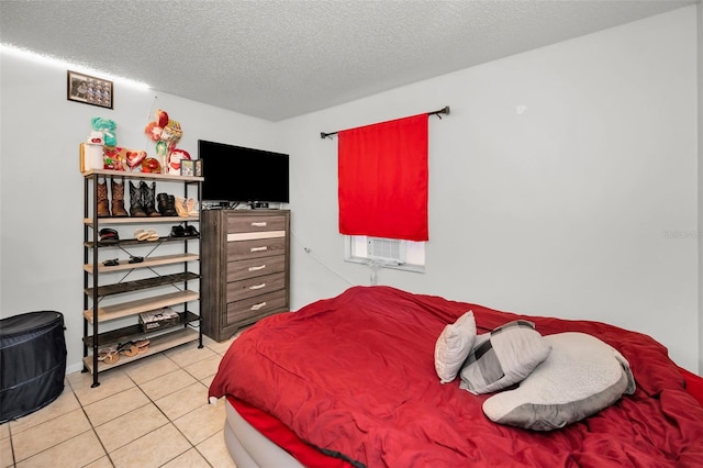 tiled bedroom with a textured ceiling