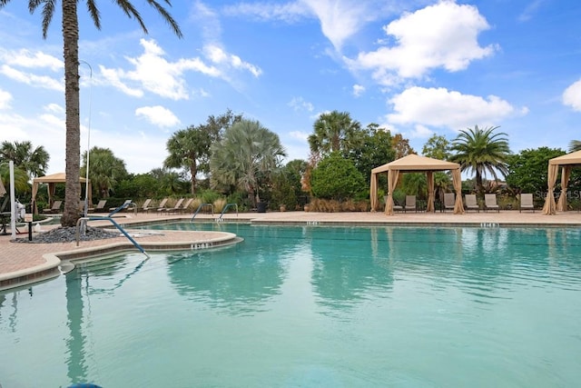 view of swimming pool with a gazebo and a patio