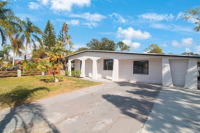 view of front of home with a garage and a front yard