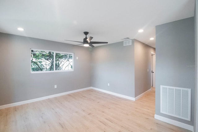 unfurnished room featuring ceiling fan and light hardwood / wood-style floors