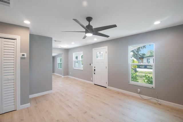 entryway with ceiling fan and light hardwood / wood-style flooring