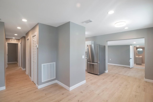 corridor featuring light hardwood / wood-style flooring