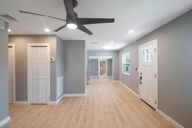 entryway with ceiling fan and light hardwood / wood-style floors