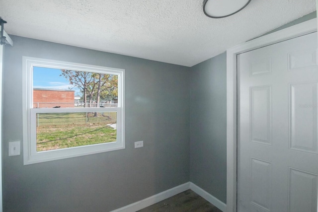 spare room featuring a textured ceiling