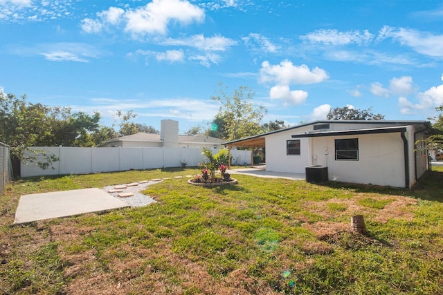 view of yard featuring a patio and cooling unit