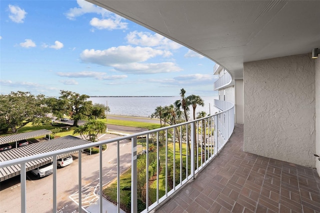 balcony featuring a water view