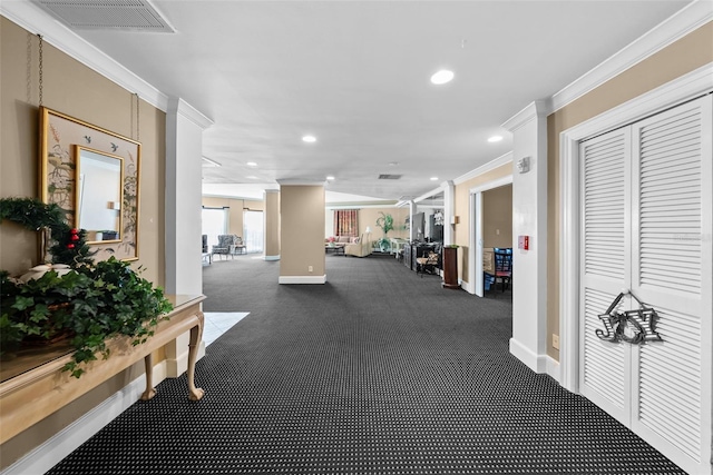 hall featuring dark carpet and ornamental molding