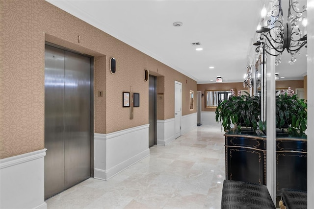 corridor with elevator and crown molding