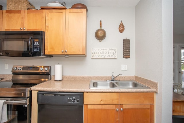 kitchen featuring black appliances and sink