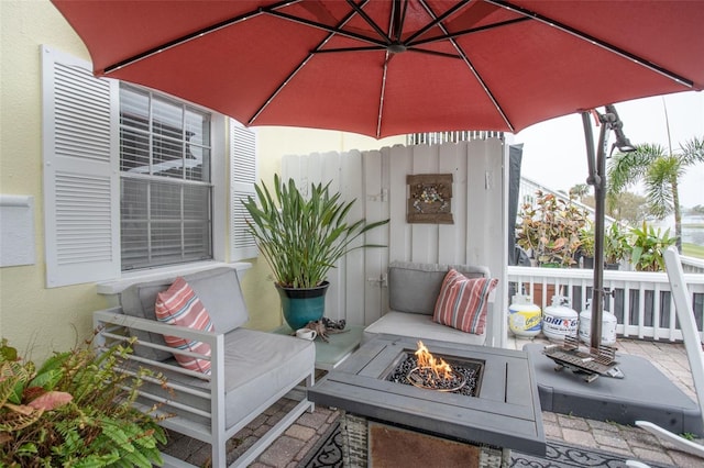 view of patio with a fire pit