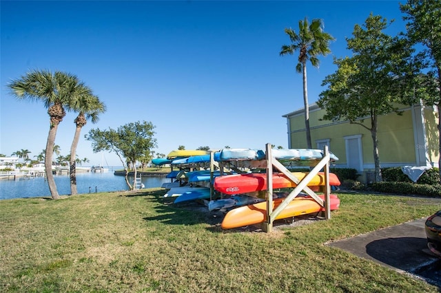 exterior space with a lawn and a water view