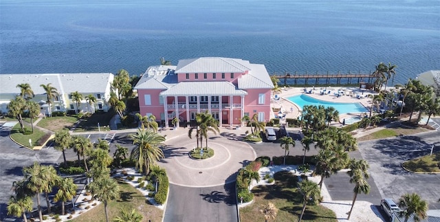 birds eye view of property with a water view