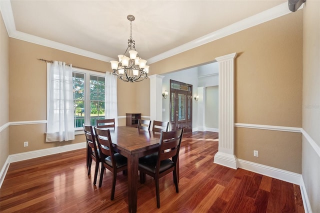 dining space featuring crown molding, dark hardwood / wood-style floors, and an inviting chandelier