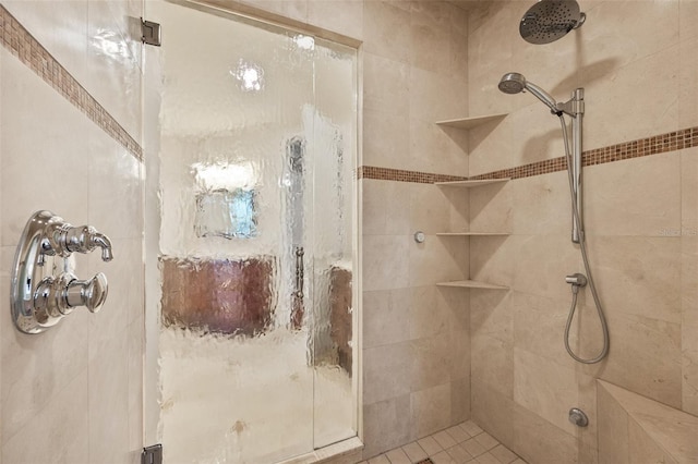 bathroom featuring a shower with door