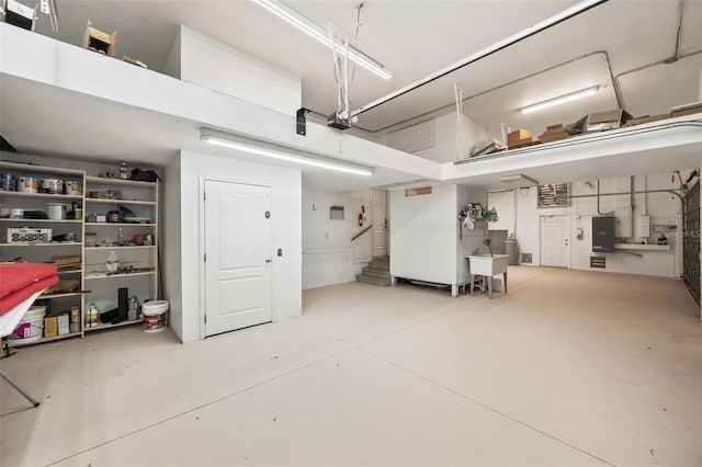 garage with sink and electric panel