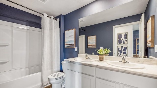 full bathroom with vanity, shower / tub combo, and toilet