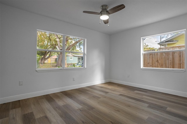 spare room with wood-type flooring and ceiling fan