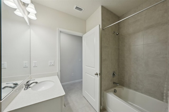 bathroom with vanity and tiled shower / bath