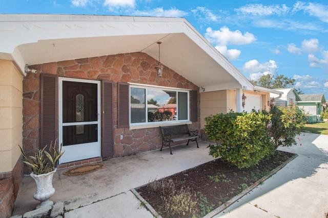 property entrance with a garage