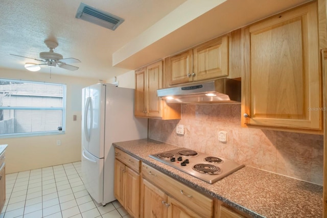 kitchen featuring ceiling fan, light brown cabinets, backsplash, white appliances, and light tile patterned floors