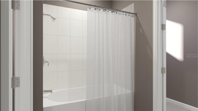 bathroom featuring shower / bath combination with curtain