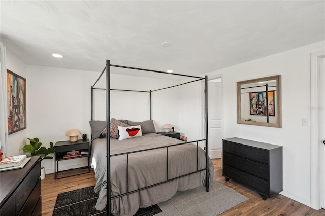 bedroom featuring wood-type flooring