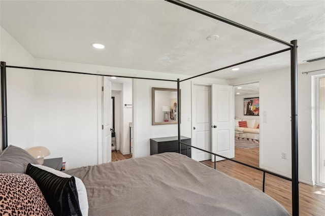 bedroom with light hardwood / wood-style floors